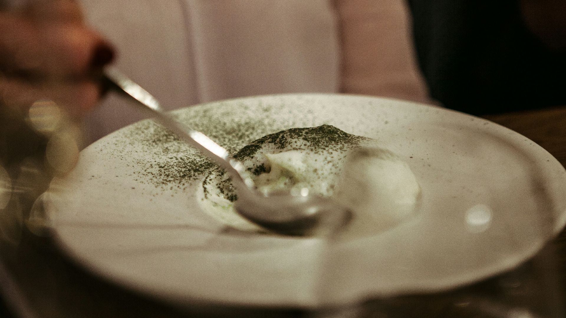 stainless steel spoon on white ceramic plate