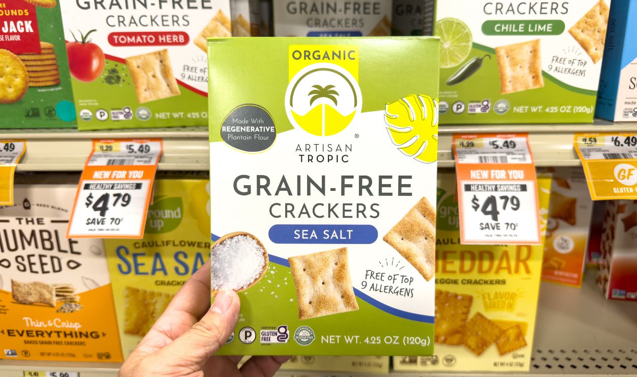 Los Angeles, California, United States - 01-01-2025: A view of a hand holding a package of Artisan Tropic grain-free crackers, at the store.