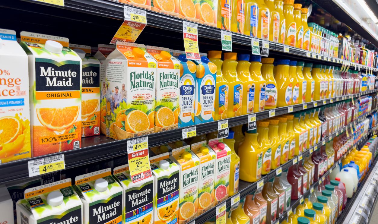 Los Angeles, California, United States - 04-14-2024: A view of several shelves dedicated to brands of orange juice, on display at a local grocery store.