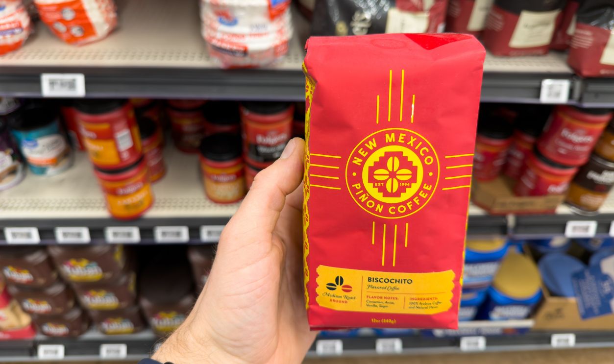 Los Angeles, CA - Marc 5, 2026: New Mexico Pinon Coffee Brick Package Held In Grocery Store Coffee Aisle