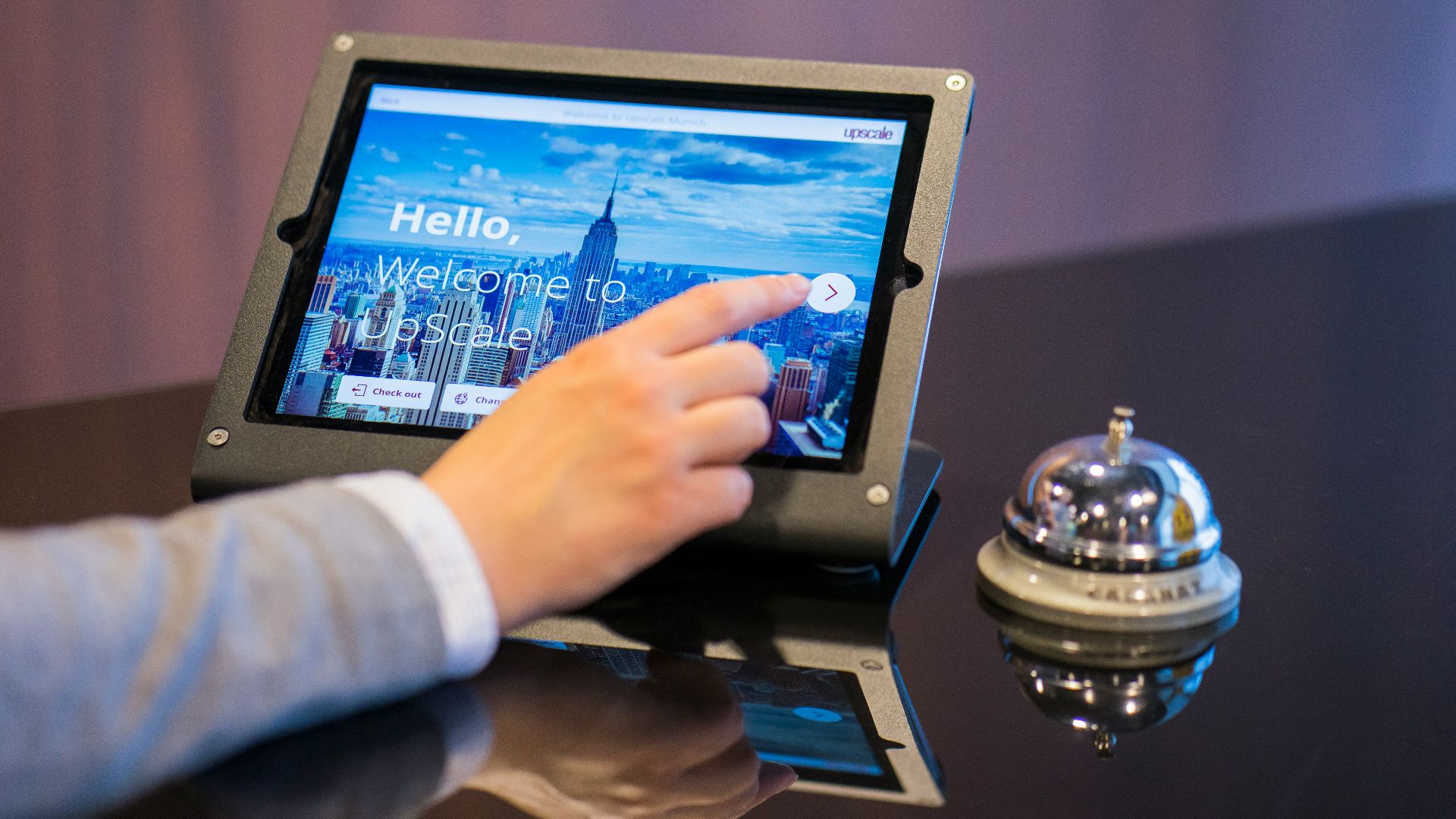 person about to touch black Android tablet computer