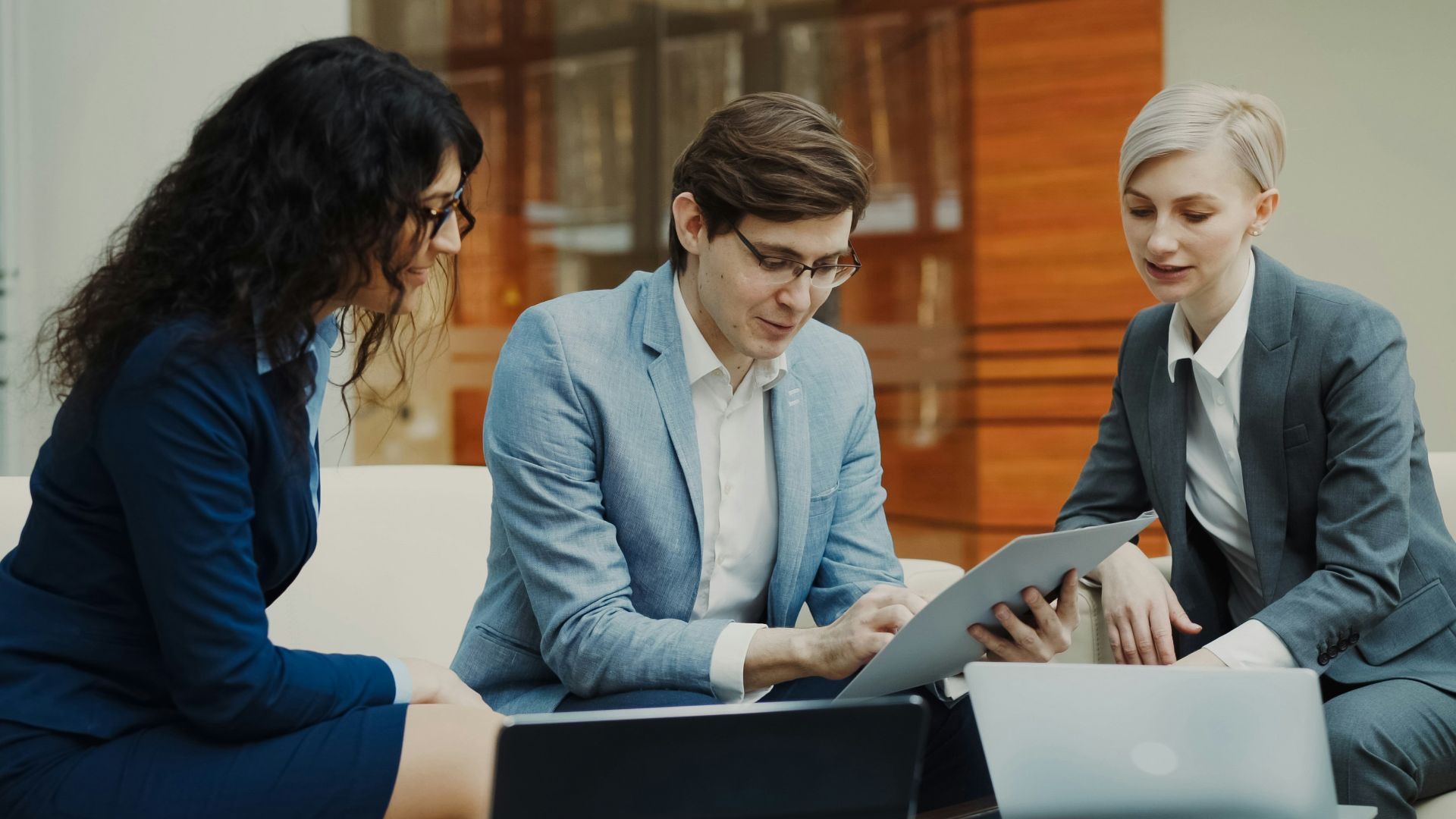 Three business people collaborating on a project
