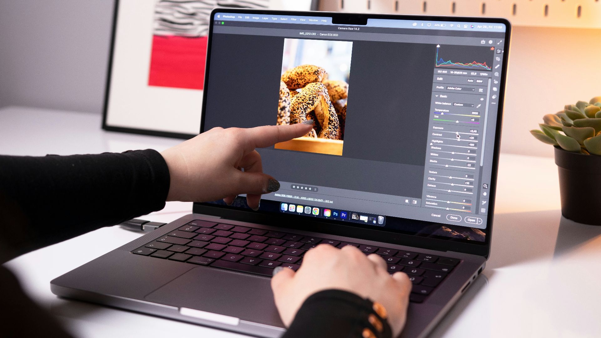A person sitting in front of a laptop computer