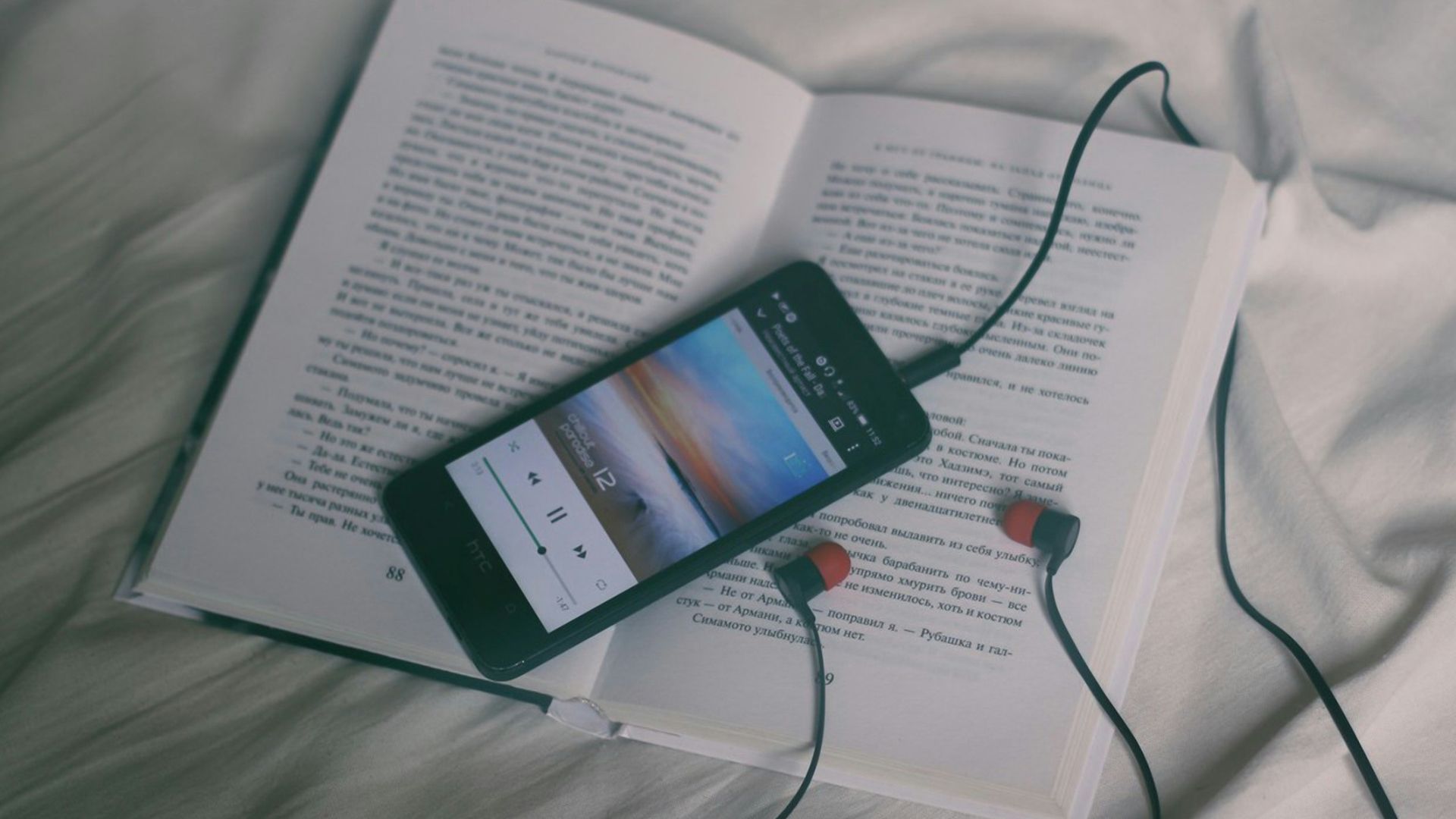 black smartphone on white book page