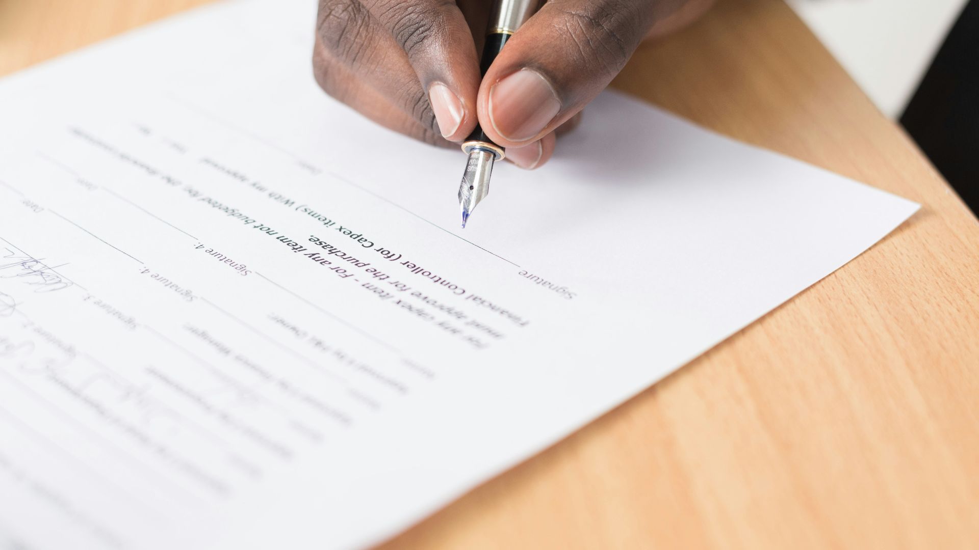 person writing on white paper