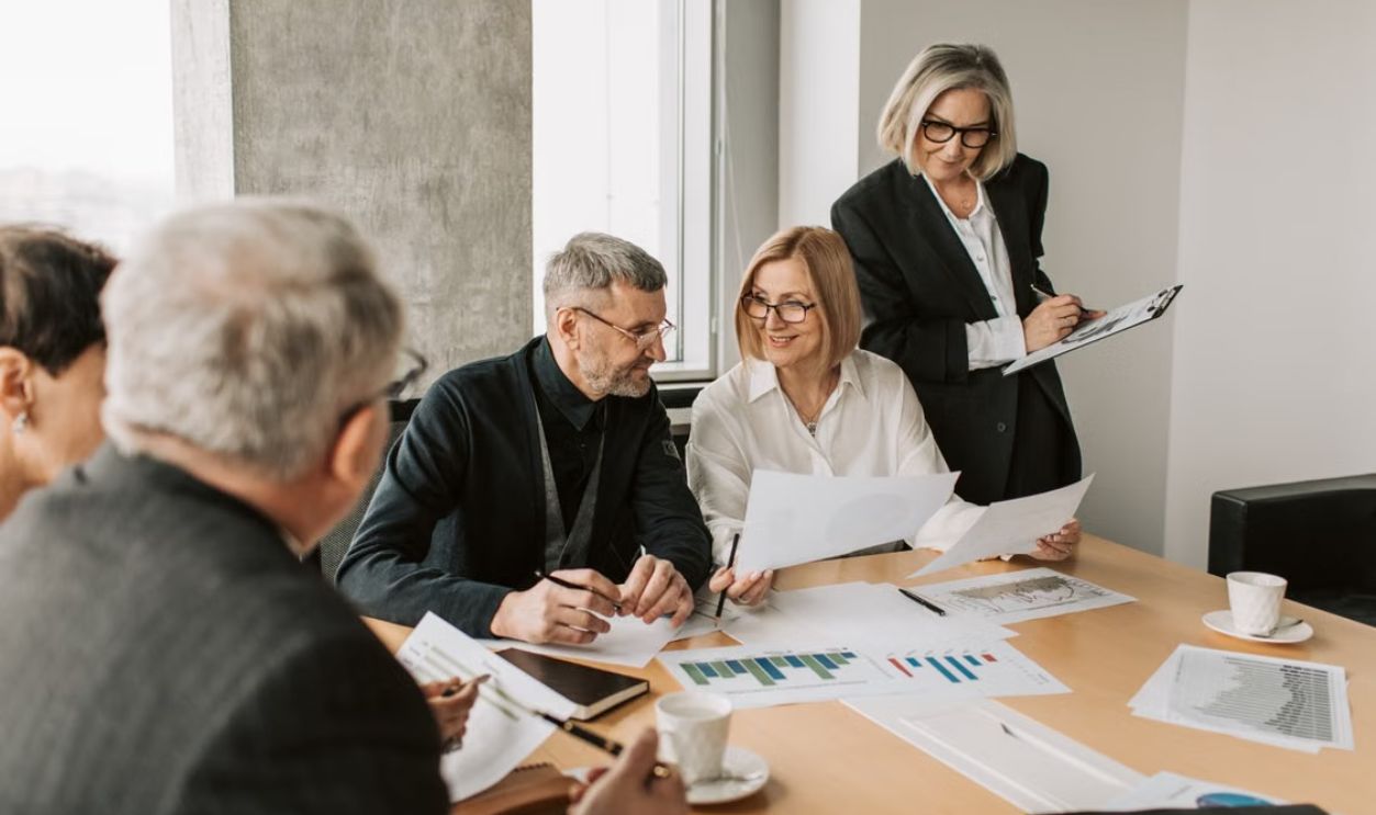 A diverse group of business professionals engaged in a strategic meeting.