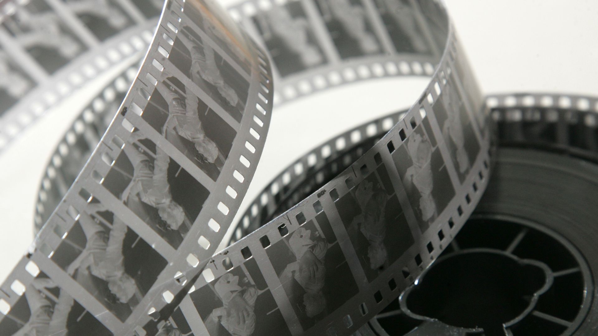 35-mm black&white movie film negative stock on the core. Classic ratio standart.