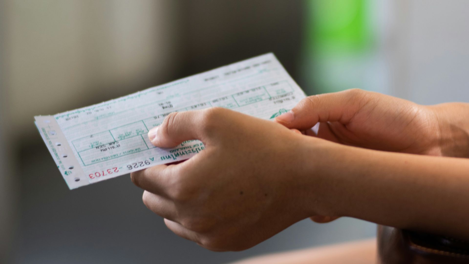 person holding white printer paper