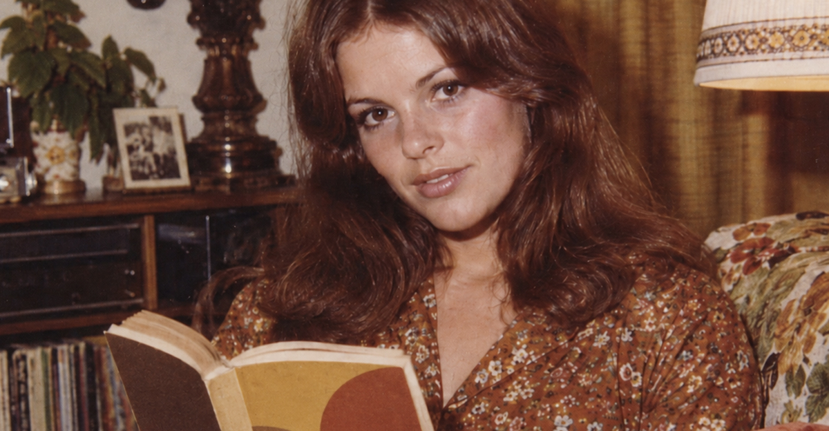 Young, beautiful woman from the 1970s, reading a book.