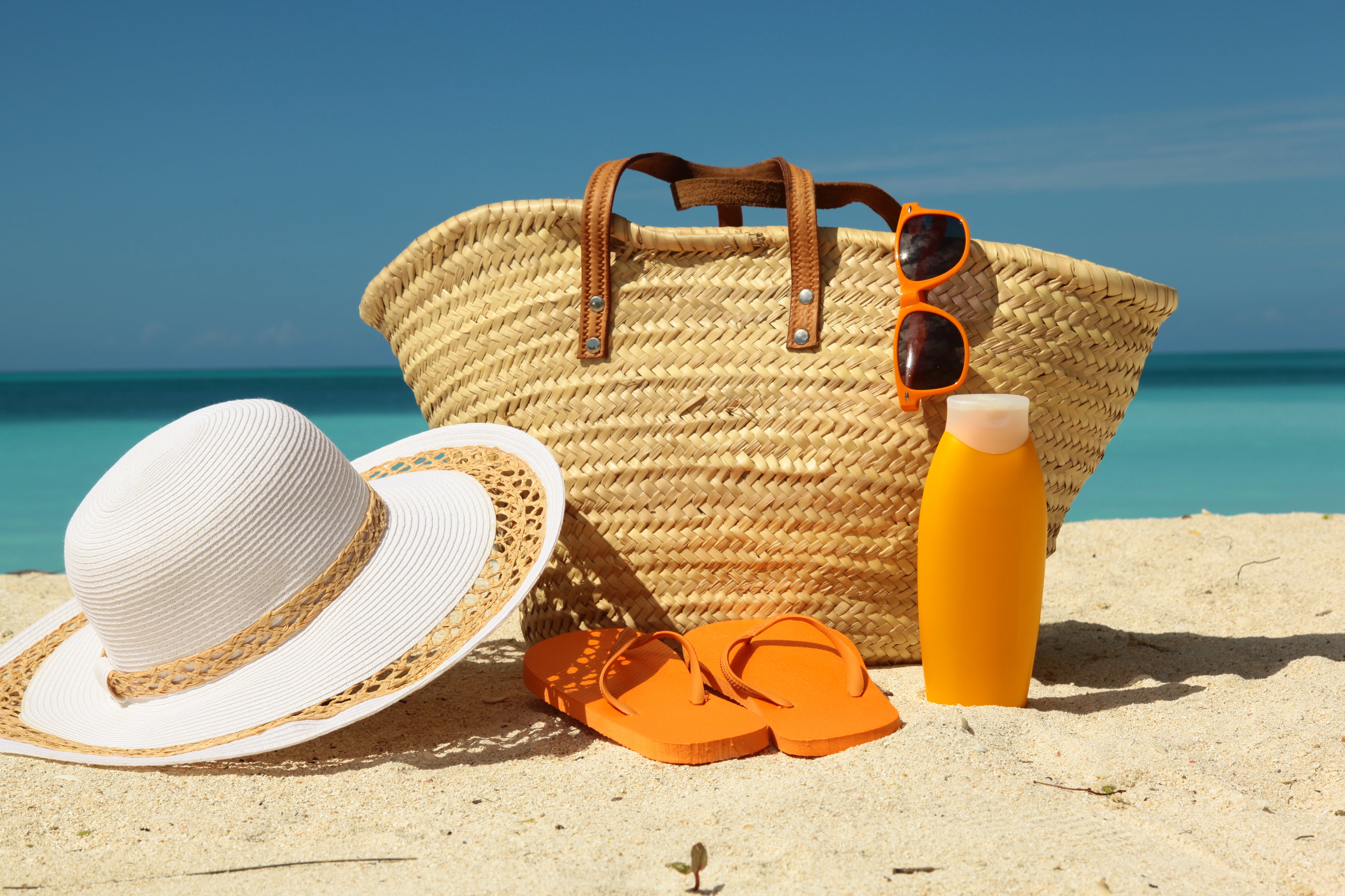 Hat and bag on beach