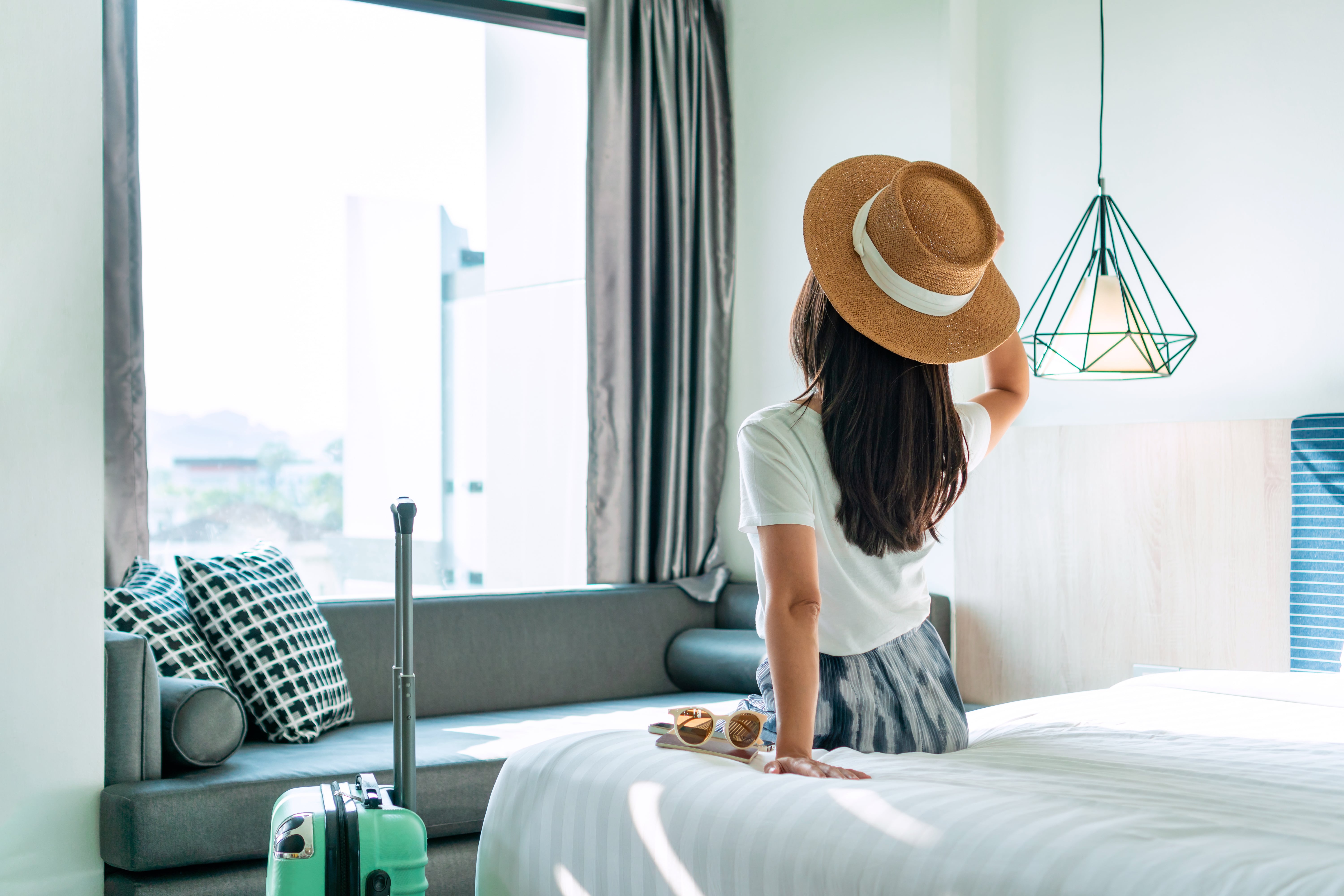 A woman in a hotel room