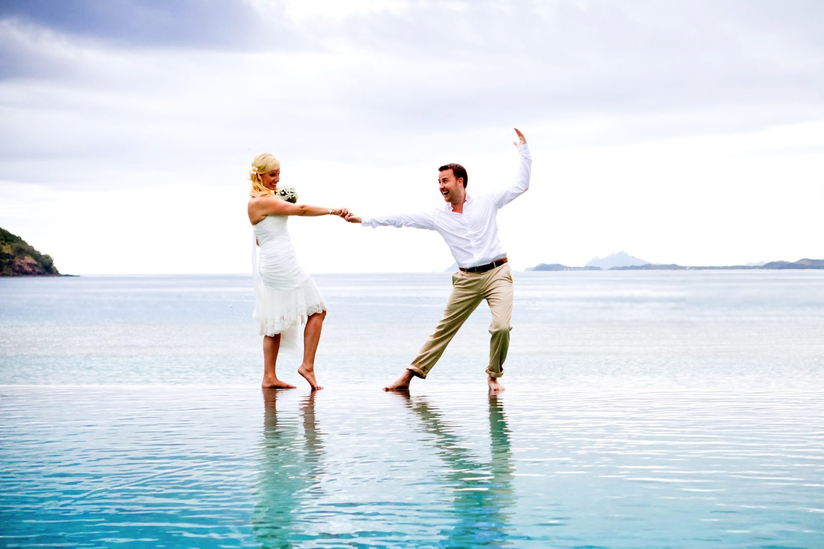 Bride and groom dancing on water
