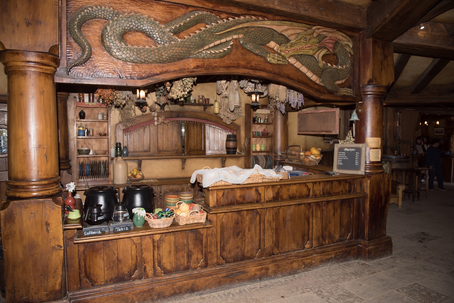 Hobbiton movie set for the Lord of the Rings and Hobbit trilogies. Ornately carved bar in the Green Dragon Inn. - 2015