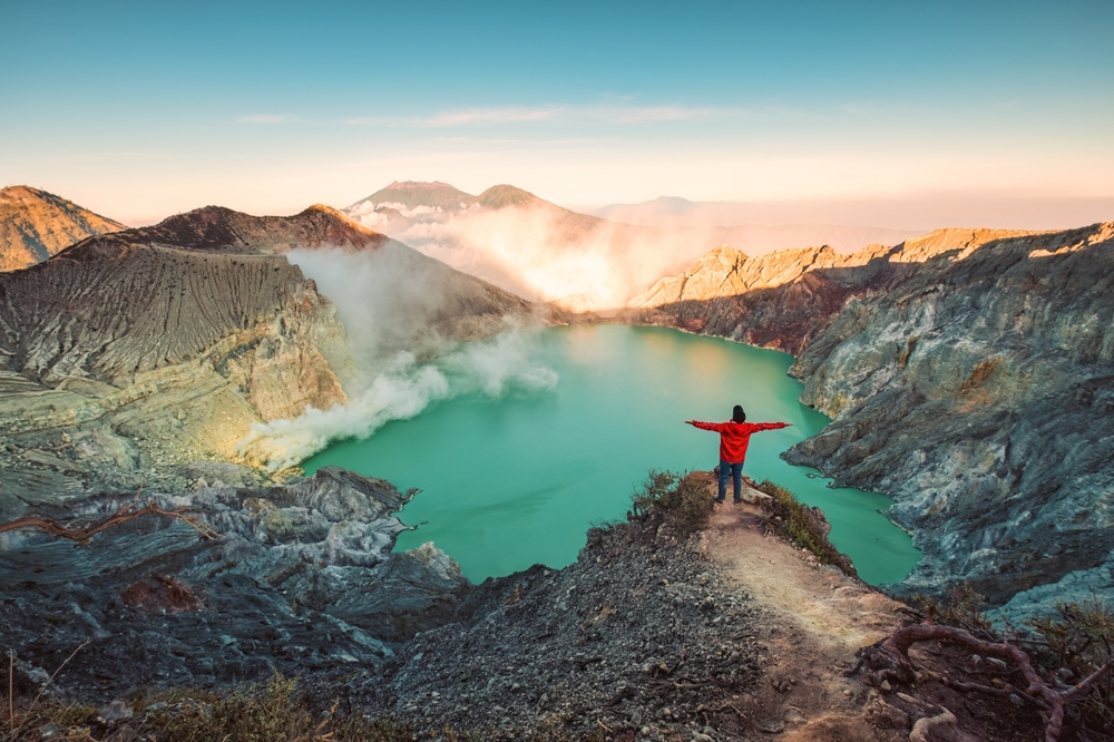 man in red close to Kawah Ijen volcano