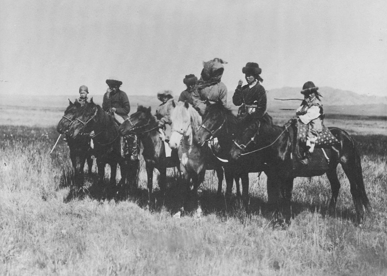 Kazakh people oh horses outside - 1900