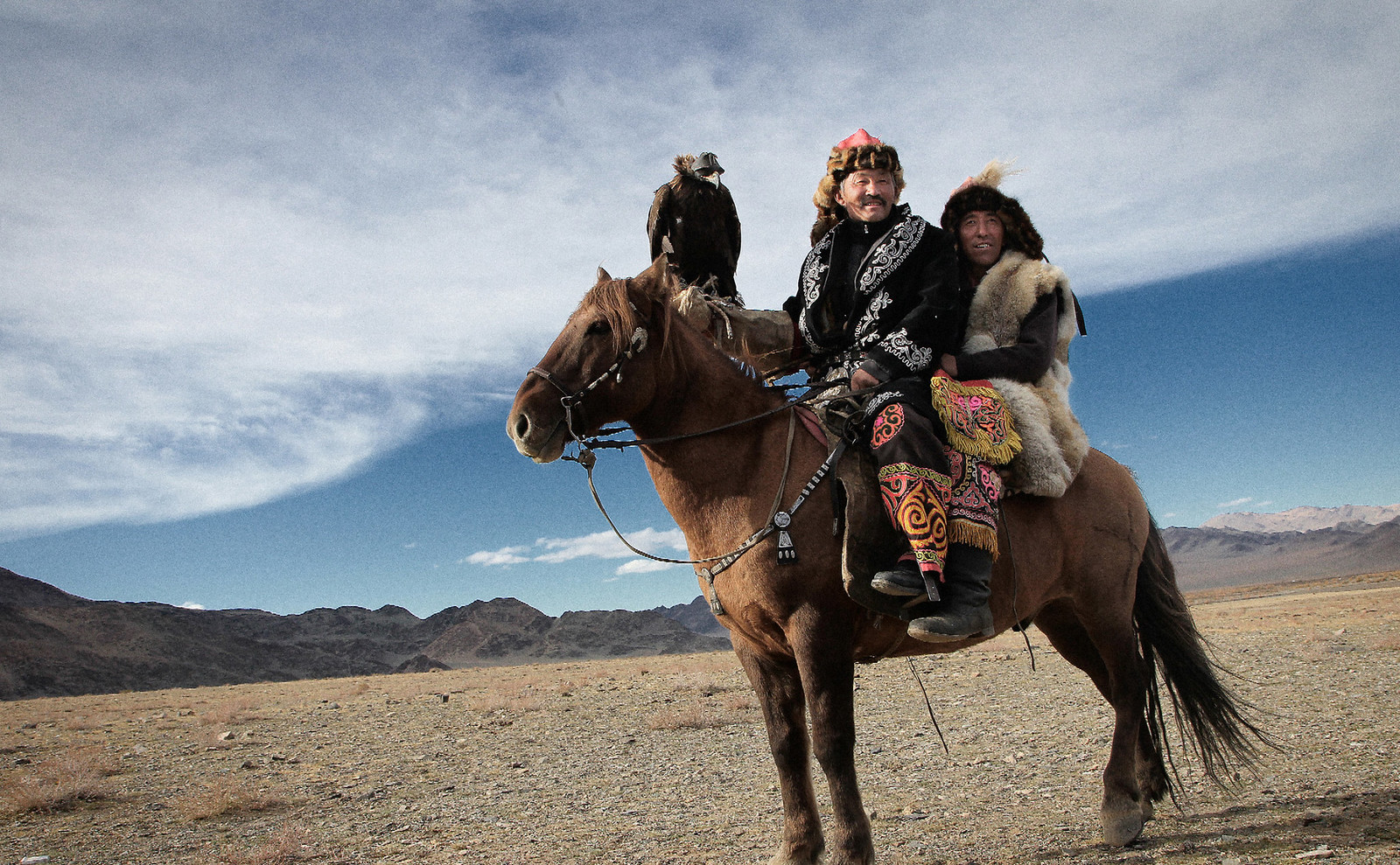 Mongolian Adventures horse-riding Kazakh eagle hunters in Mongolia - 2014