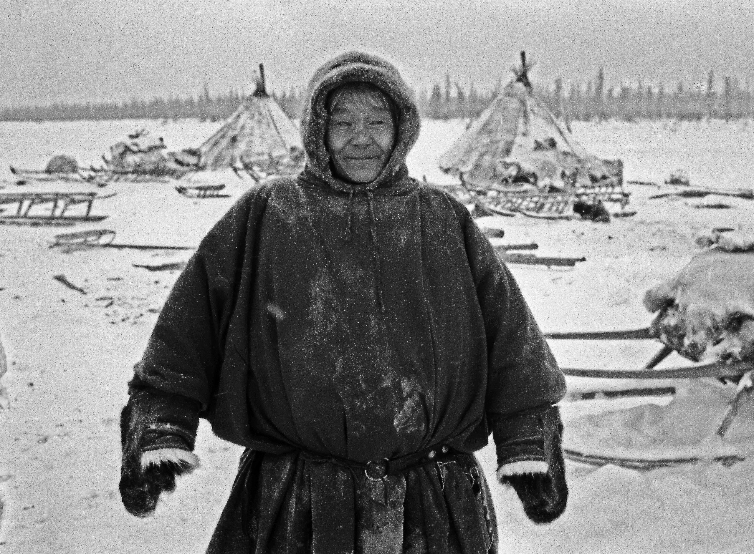 Nenets man and their tents