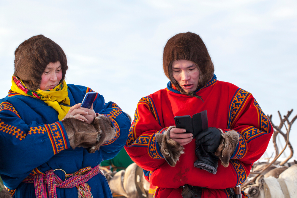 Nenets men with smartphones