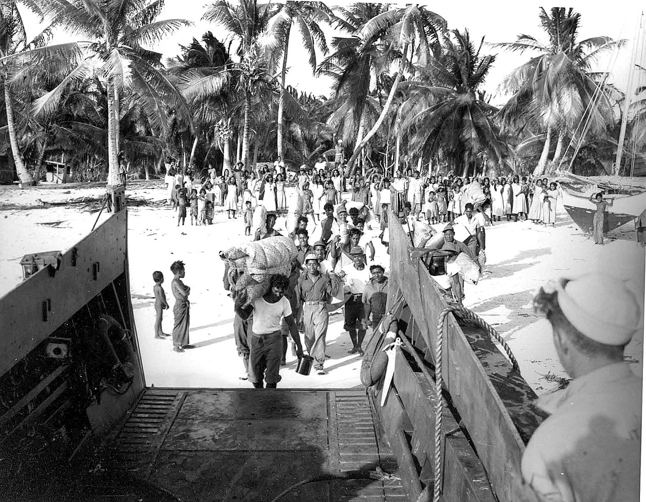 Bikini Islanders board a landing craft, vehicle - 1946