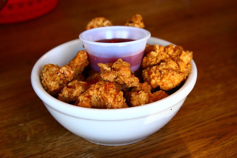 Close-up photo of Fried Gator chops in a white bowl