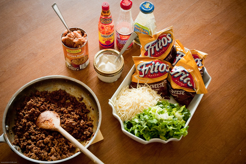 Cooking pan with meat and other ingredient for preparing a walking taco