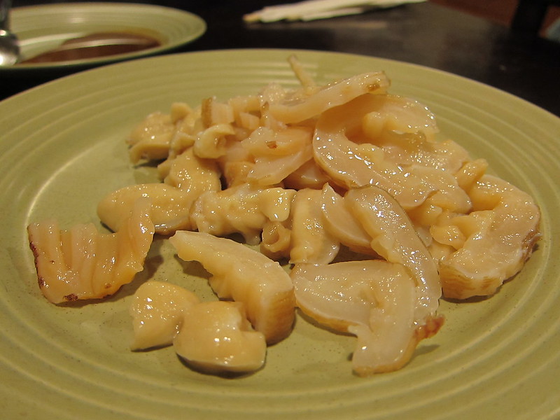 Close-up Photo of Geoduck Sashimi on a green plate