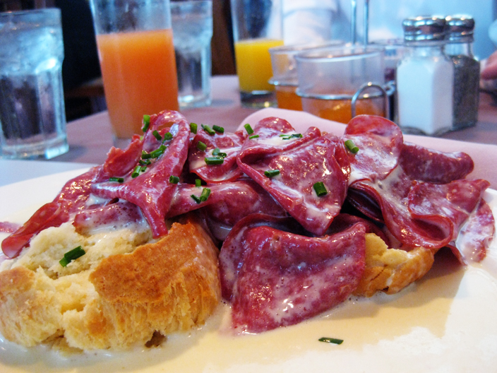 Close-up photo of a Cream chipped beef over biscuits
