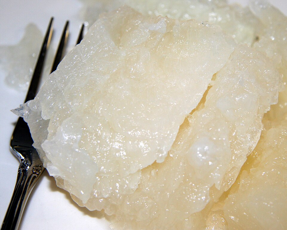 A fork next to a serving of lutefisk