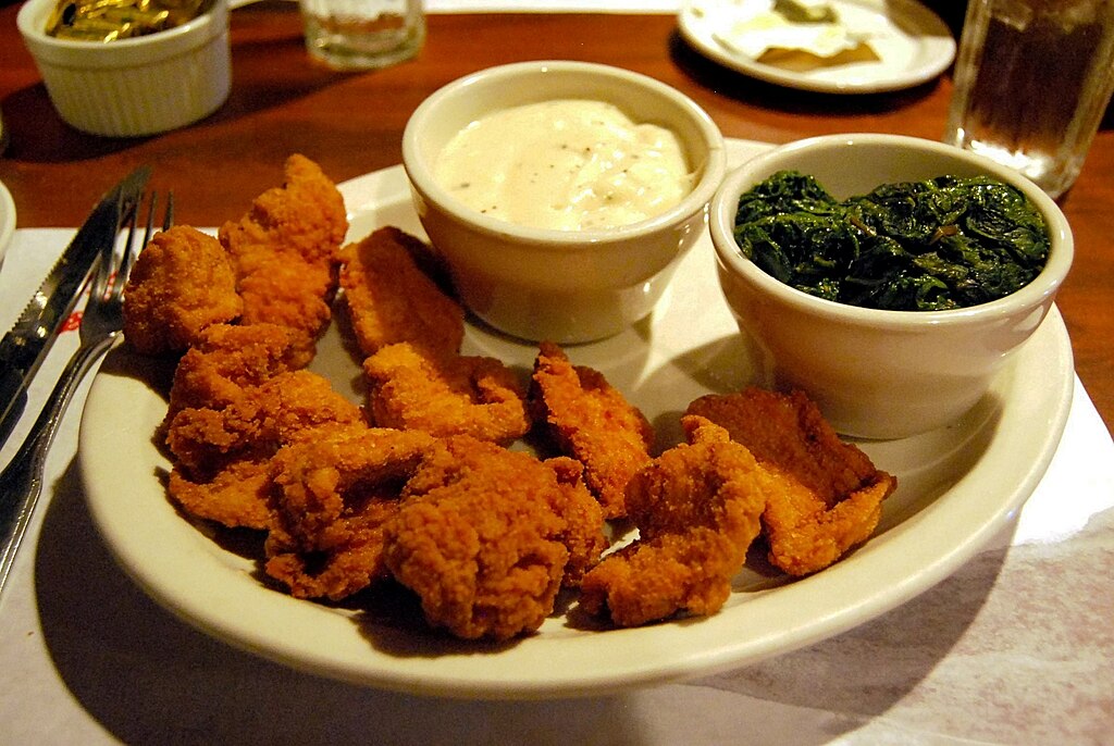 Close-up Photo of Lamb fries on a white plate