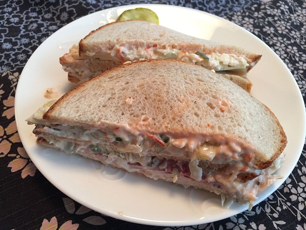Close-up photo of a Sloppy Joe Sandwich on a white plate