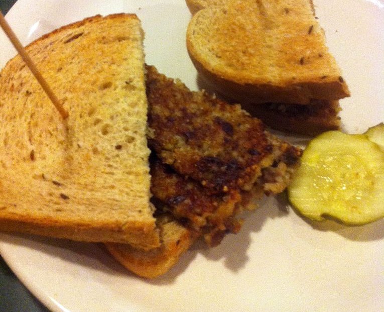 Close-up Photo of a Goetta sandwiches on a white plate