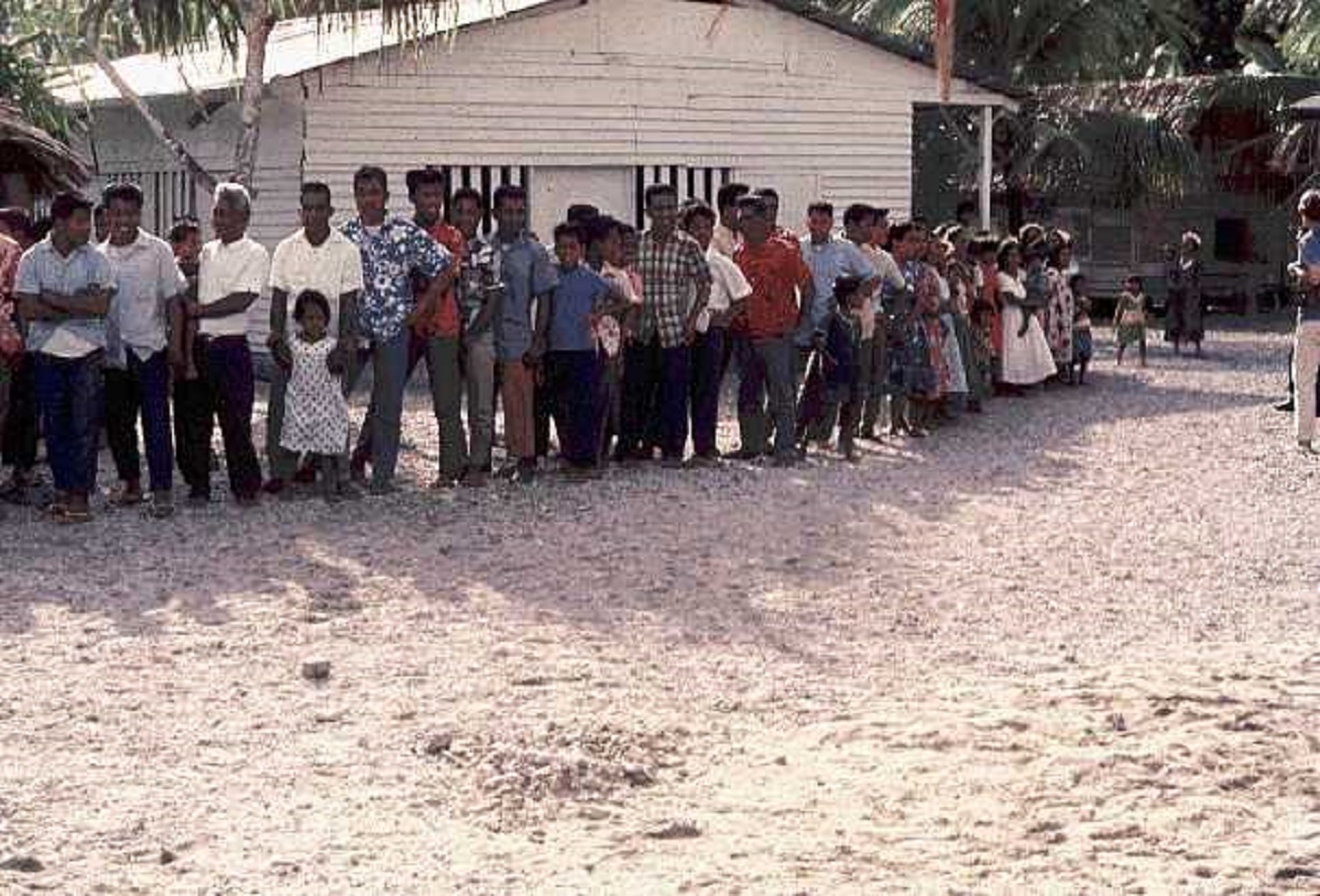 People of Bikini Atoll - A group of people standing in front of a building