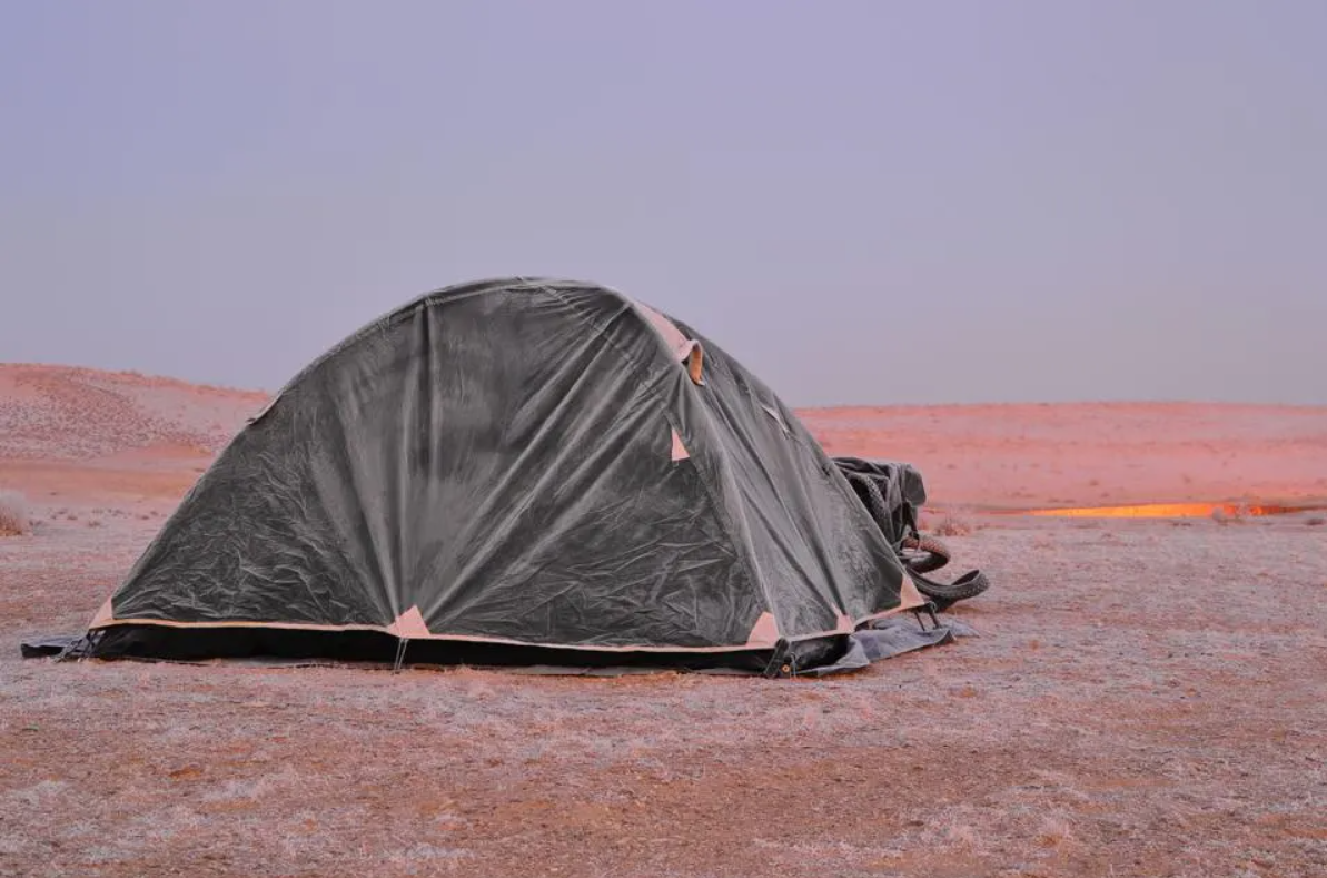 Camping beside gas crater