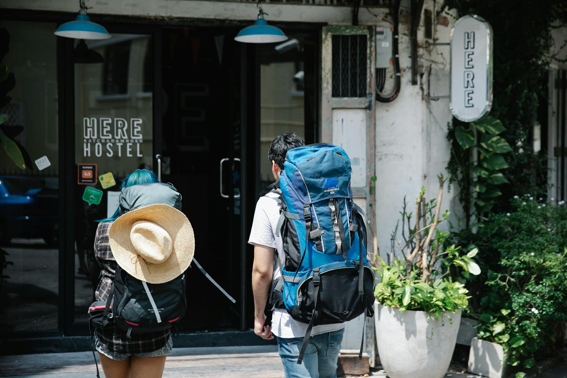 Man and Woman About to Go Inside a hostel