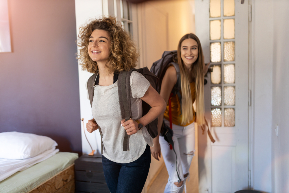 Young female tourists with backpacks