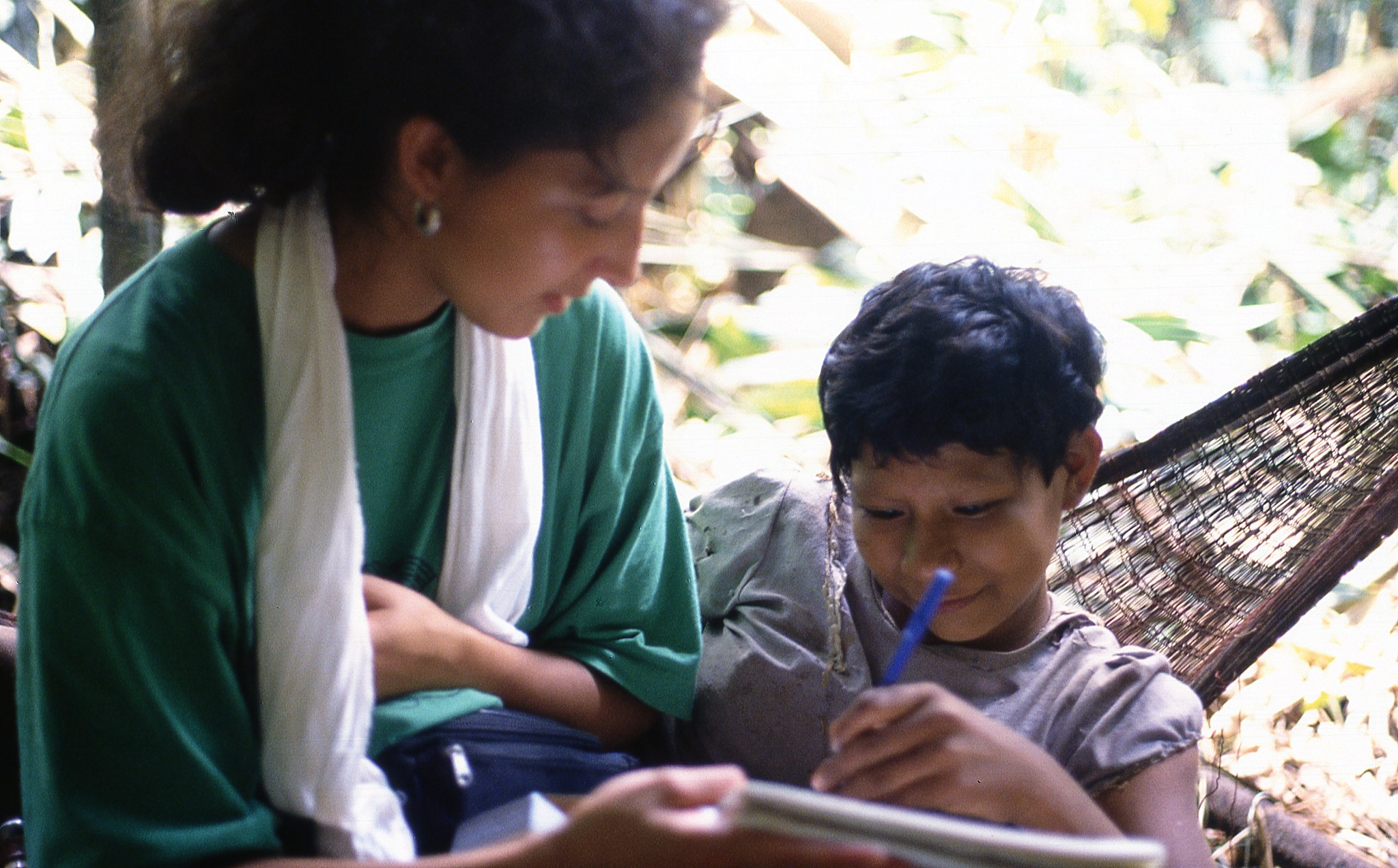 Nukak girl with a volunteer