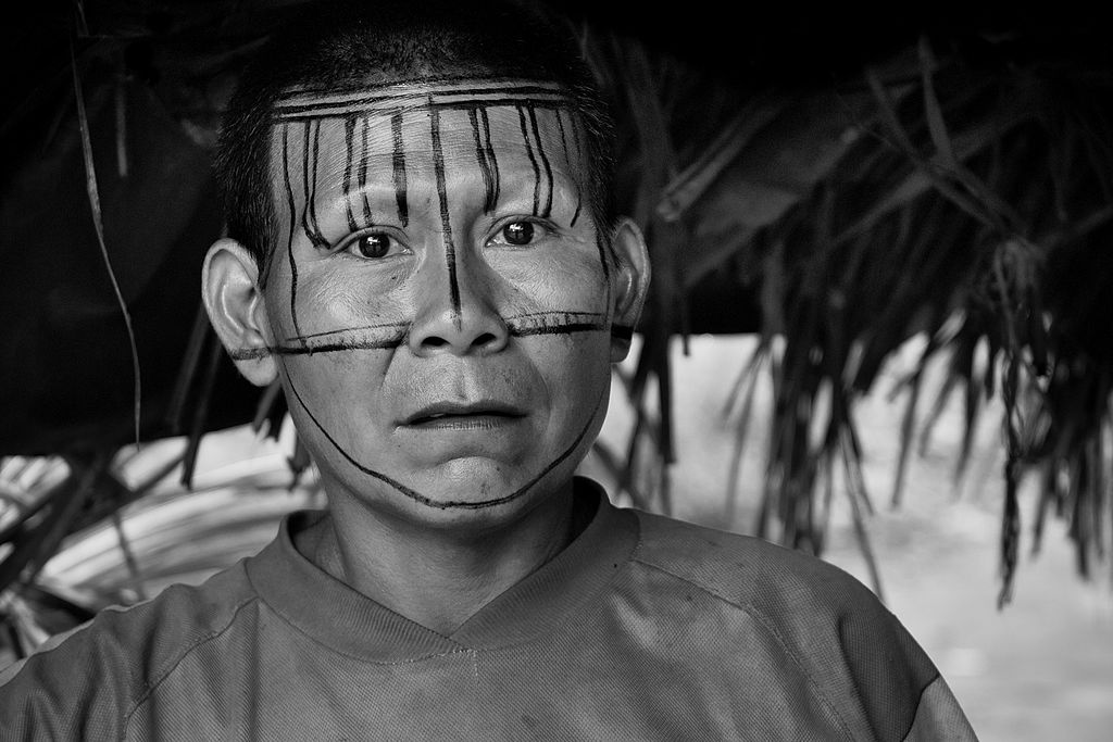Nukak woman with her face decorated with the red dye