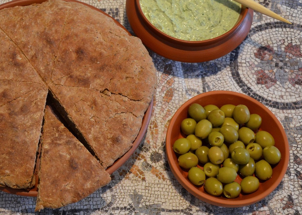 Close Up Photo of Moretum and Roman bread