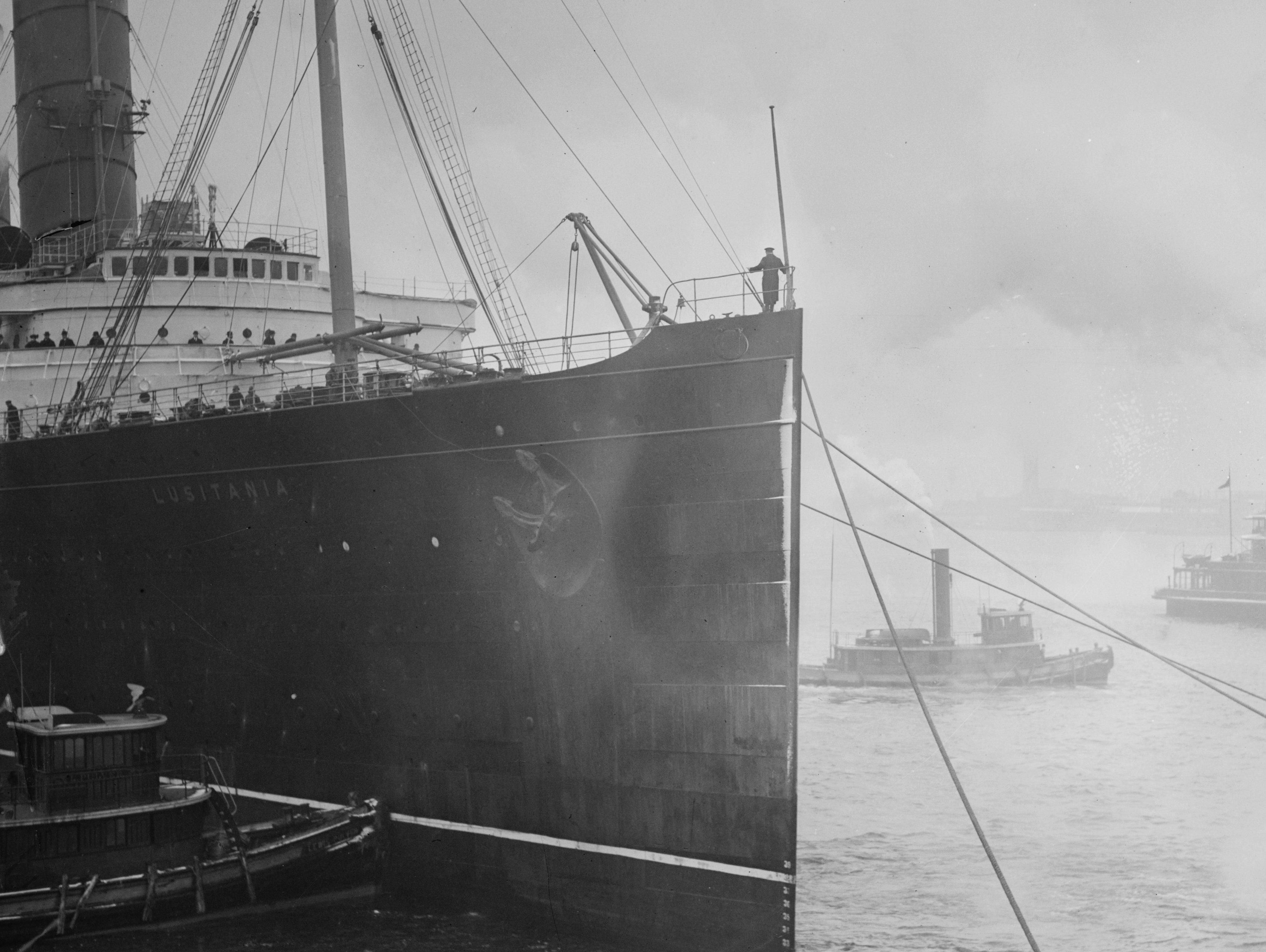 Grayscale Close Up Photo of RMS Lusitania on a dock
