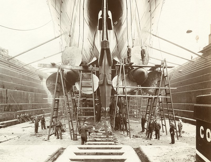 Grayscale Photo of the Stern of Lusitania on stocks showing the propellers