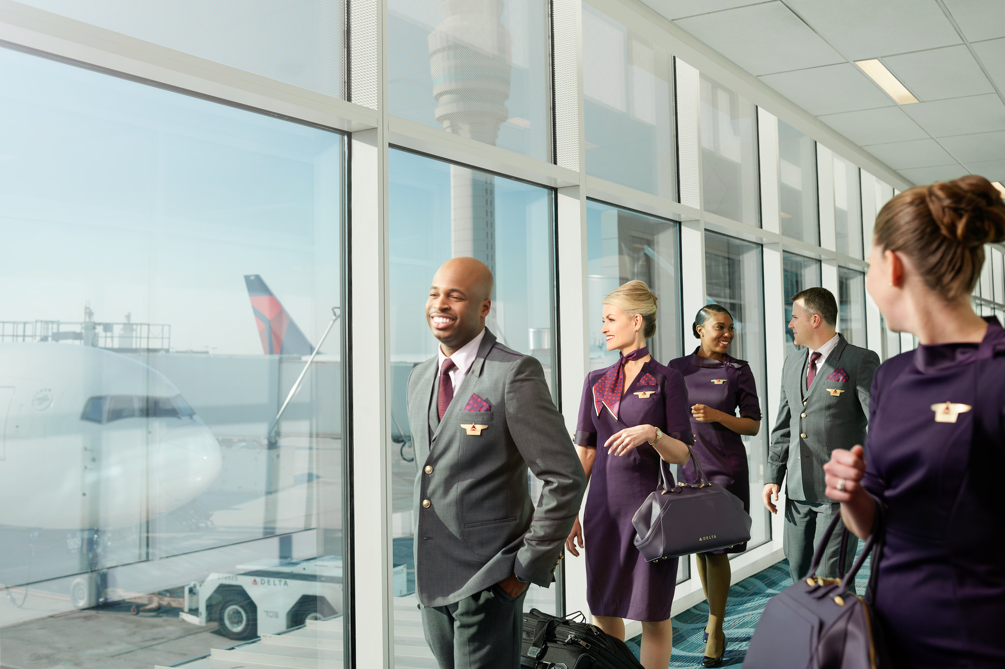 Flight attendants walking to the plane
