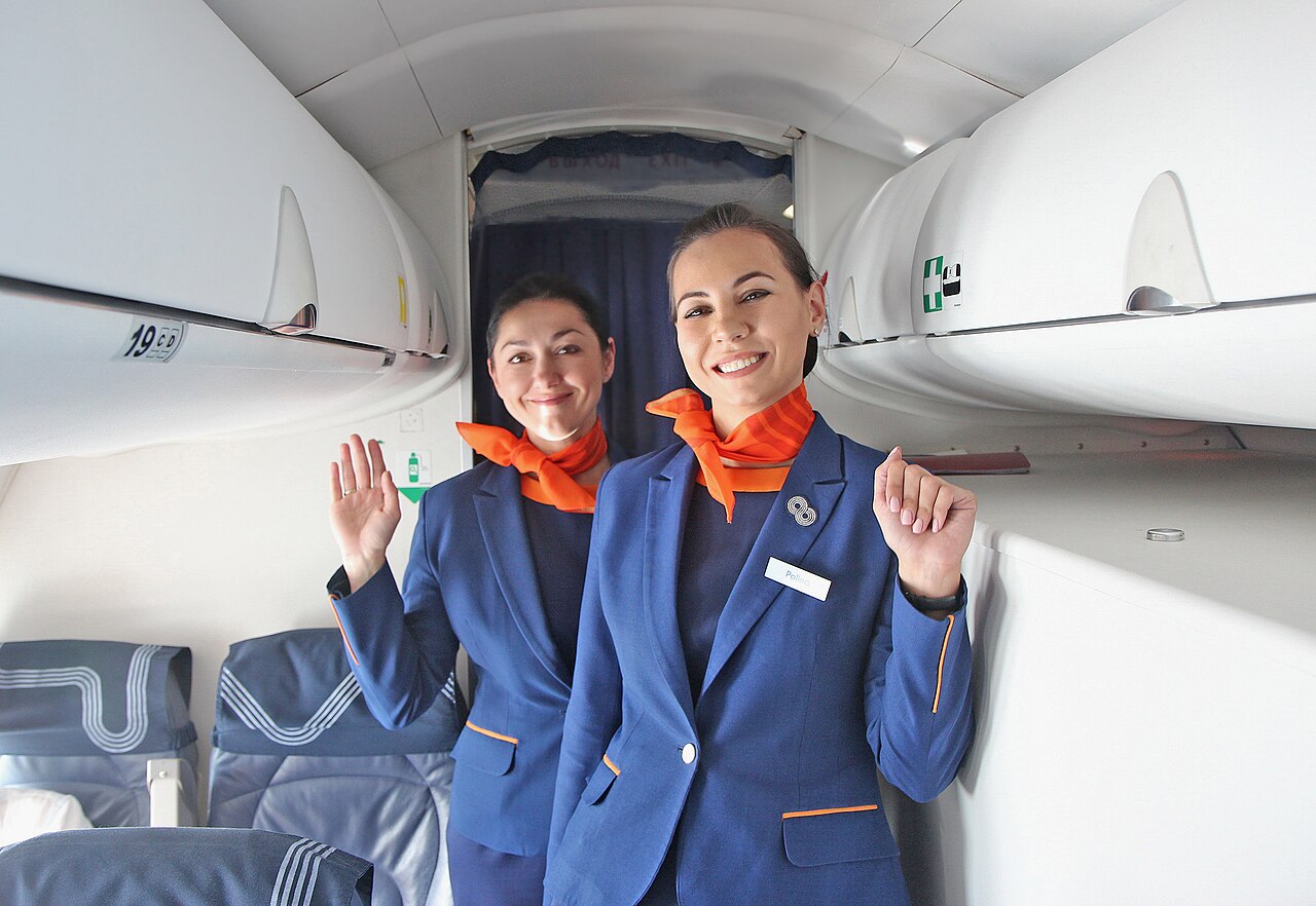 Flight Attendants Posing for Aurora Airlines