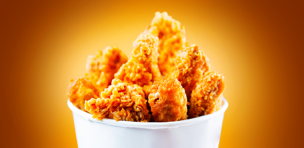 Bucket full of crispy fried chicken
