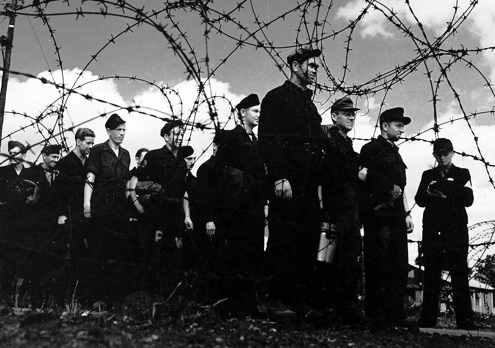 German POWs in a prison camp stand to attention