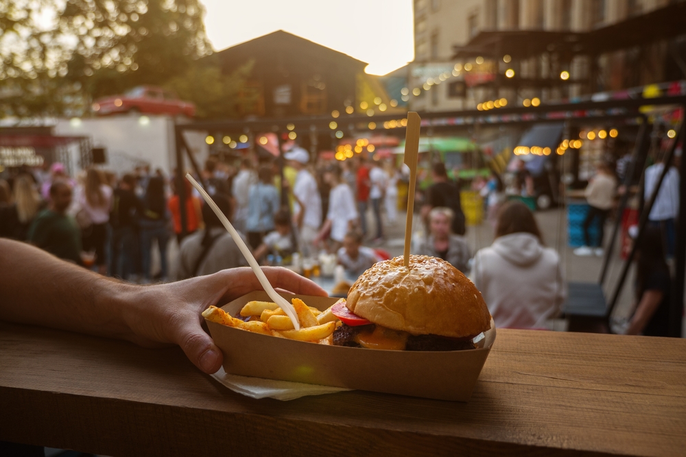 Man hands holding street food burger