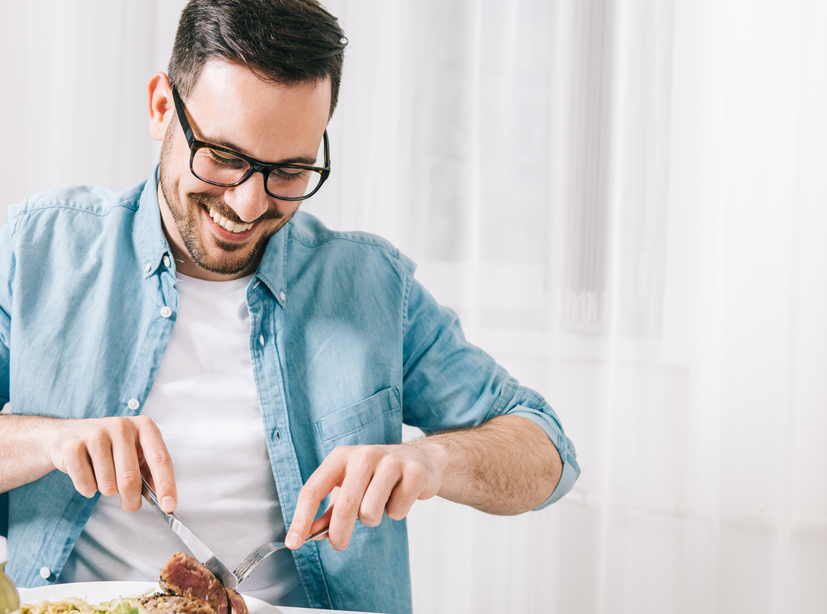 Man eating healthy food and drink detox juice