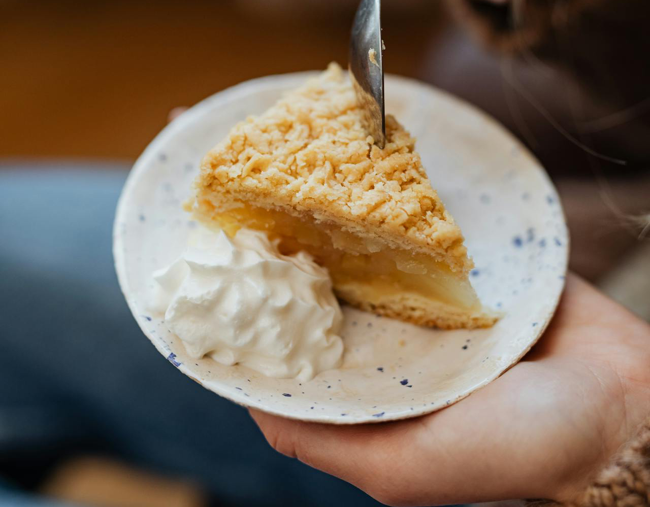 Woman Eating a Slice of Apple Pie
