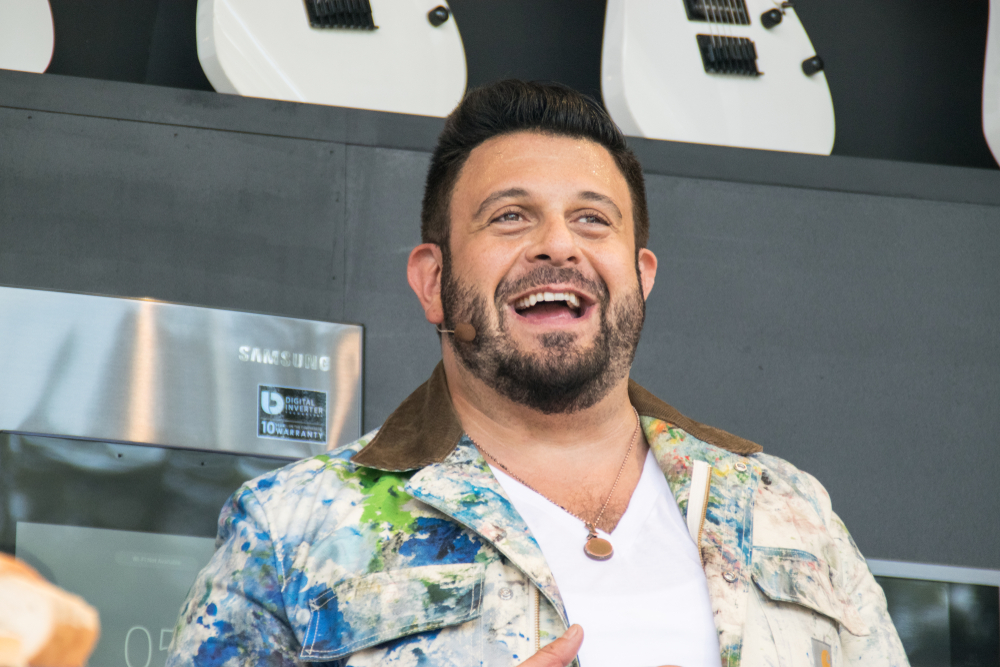 Adam Richman in colorful jacket