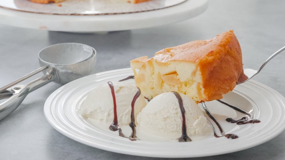 Apple pie and ice cream on white plate