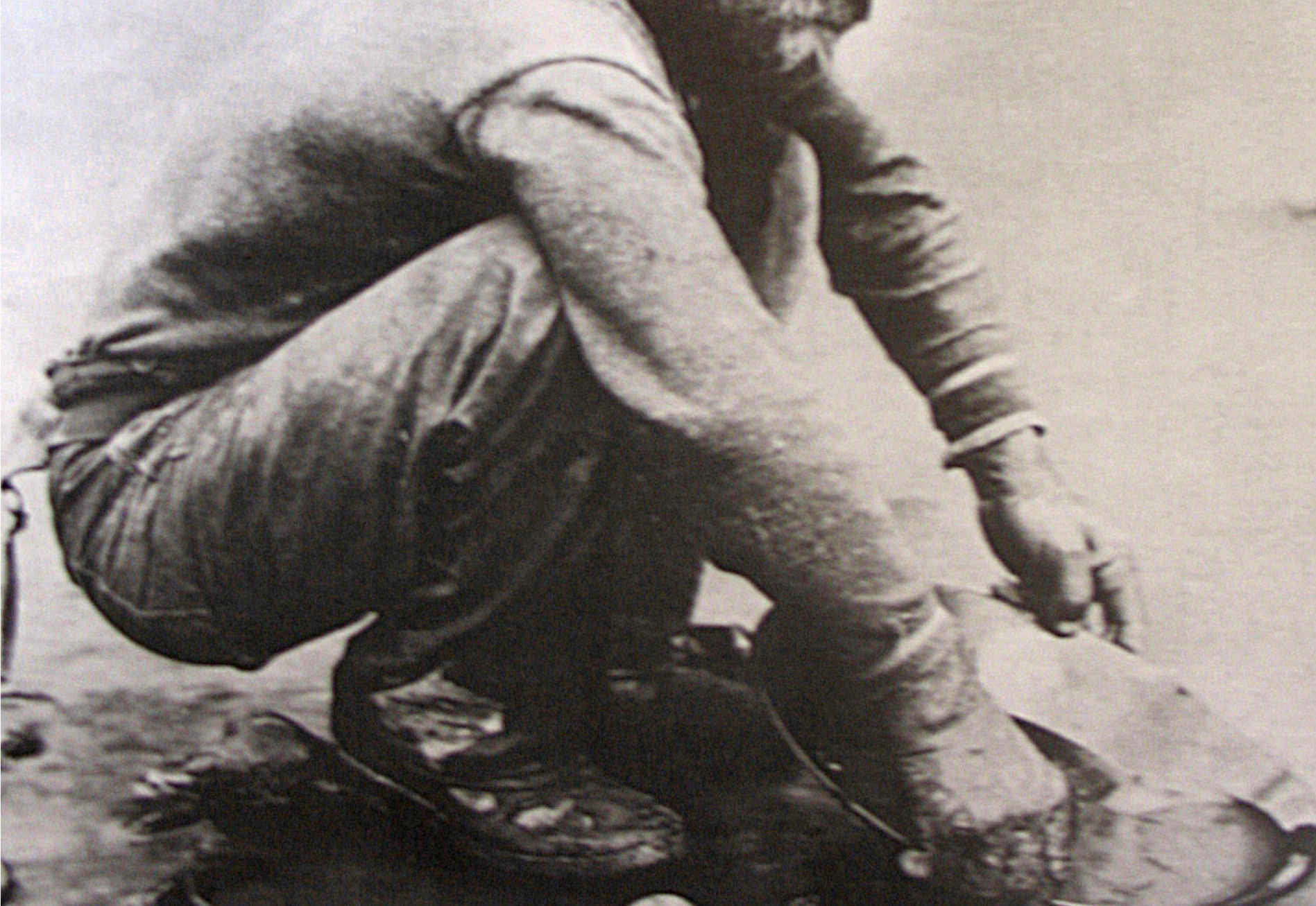 A man panning for gold in California